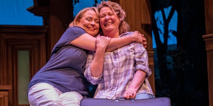 Martha Irving and Shelley Thompson share a moment as best friends Chris and Annie in Neptune Theatre's Calendar Girls. Photo by Stoo Metz.