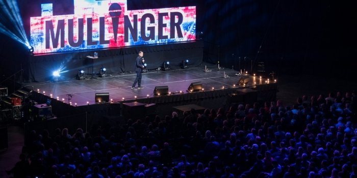 In April of 2016, Mullinger sold out Harbour Station Arena (now TD Station) in Saint John, outselling Jerry Seinfeld, Iron Maiden, Def Leppard and Jeff Dunham. It sparked a CBC documentary about the record-breaking arena show. The comedian beat out his own record by selling out the venue for the second time in 2018.