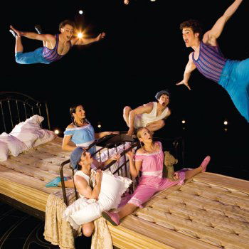 Flying high: six artists jump on two 600-pound beds that move on rotating platforms in Cirque du Soleil's Corteo. Photo courtesy of Cirque du Soleil's Corteo.